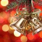 Golden Christmas tree decorations on lights background
