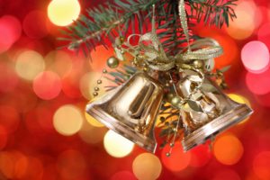 Golden Christmas tree decorations on lights background