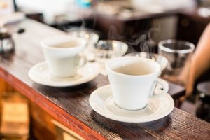 Cups of drip coffee on bar of coffee shop